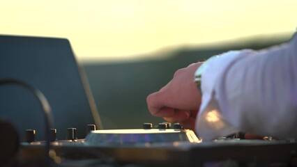 DJ Music. DJ during outdoor festival. modern electrical sound mixer console during concert. Professional sound system dj console.