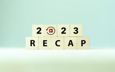 2023 Recap economy, business, financial concept. Business plan in 2024. RECAP words and 2023 on wooden cubes on smart grey background and copy space.