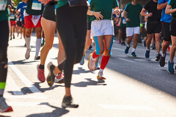 Fototapeta na wymiar Runners on the street. Healthy lifestyle. Jogging exercise. Athletics