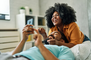 woman selfie phone man couple camera mobile phone portrait smartphone happy young romance together love photo picture fun technology looking relationship boyfriend girlfriend - Powered by Adobe