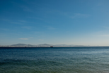 Fototapeta na wymiar background seaside landscape, mountains, ferry, summer vacation ın Istanbul