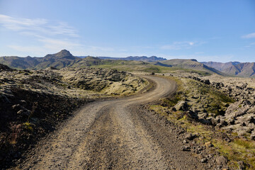 A view of the dirt road among the lava fields. Helgafellssveit, Iceland.