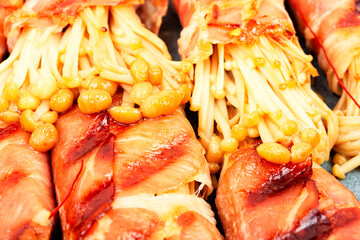 Enoki mushroom appetizer fried in bacon