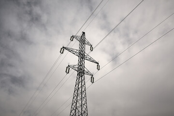 poles and high voltage wires - obrazy, fototapety, plakaty