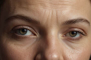 Portrait of a caucasian woman in a medium forest with signs of aging, mimic wrinkles, close-up.