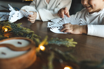 Children cut out snowflakes, Christmas activity