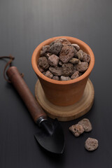 Pumice in a clay pot.