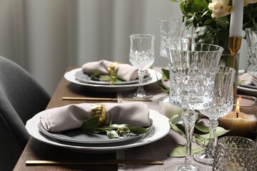 Beautiful table setting with floral decor indoors