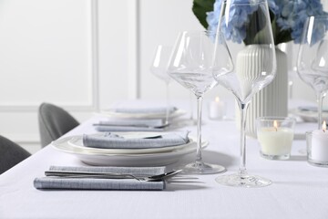 Beautiful table setting with floral decor indoors