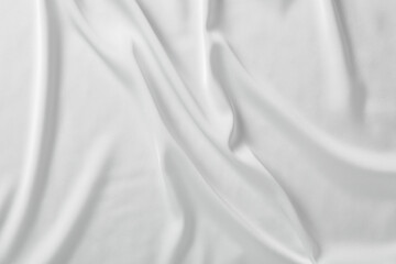 Fototapeta premium Texture of white silk ripple fabric as background, top view