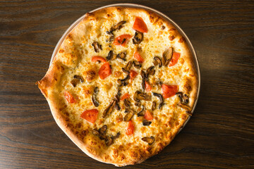 white pizza with mushrooms and tomatoes