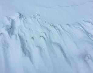 Relief and shadows of a snowdrift