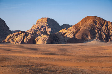 Rocks and mountains at sunset in the red  Wadi Rum desert in Jordan