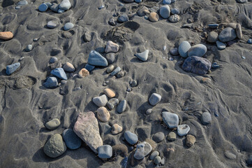 sea ​​pebbles on the sand of the beach 5