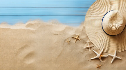 LIGHT BLUE BOARD WITH BEACH SAND, HAT AND STARFISH. BACKGROUND.