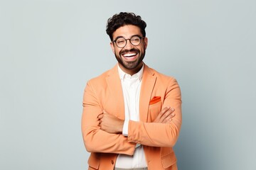 Emotional Wellness: Professional therapist showcasing genuine compassion and a comforting smile on a plain background, underlining the vital connection between mental health and effective counseling