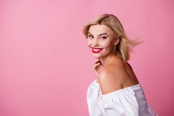 Photo of adorable cute graceful girl dressed white clothes posing empty space isolated on pink color background