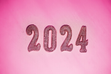 2024 New Year. Numbers of the coming new year on a pink background. Trendy color of the outgoing year in the style of a fashion doll