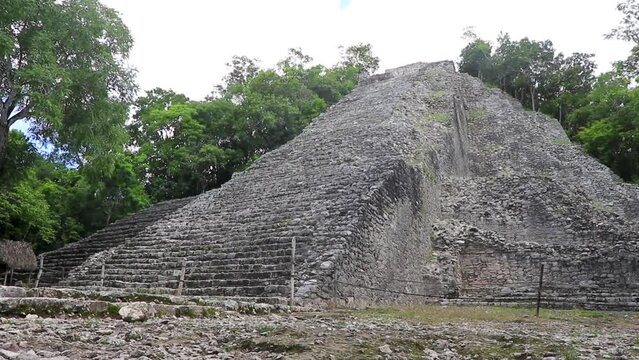 Coba Maya Ruins Nohoch Mul pyramid in tropical jungle Mexico.