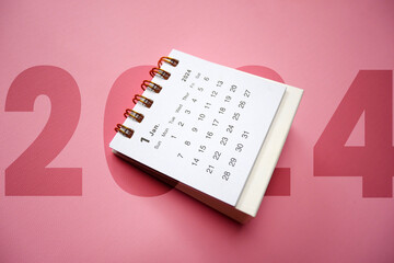 Welcome 2024. January 2024 desk calendar isolated on pink background. Similar image on my portfolio.