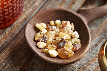 Frankincense resin on a woodne spoon