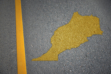 yellow map of morocco country on asphalt road near yellow line.