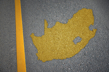 yellow map of south africa country on asphalt road near yellow line. © luzitanija