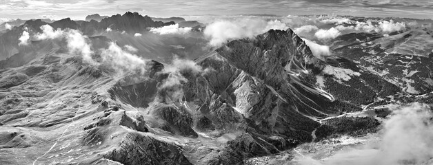 Black and white theme: Mountainscape of Dolomite peaks around Furcela de Pütia in Passo delle Erbe pass, autumn, sunny day. Dolomites, Italy.