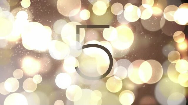 Animation of countdown to midnight over spot lights background