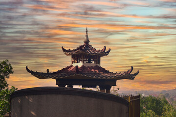 The roof of the temple, a place of worship for the Confucian community, with a beautiful sky in the...