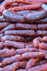 Fototapeta premium Chorizos and morcillas, typical products of the Spanish gastronomy homemade and for sale in a traditional street market.