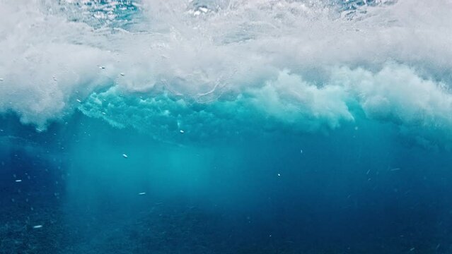 Underwater view of the ocean wave breaking over the reef