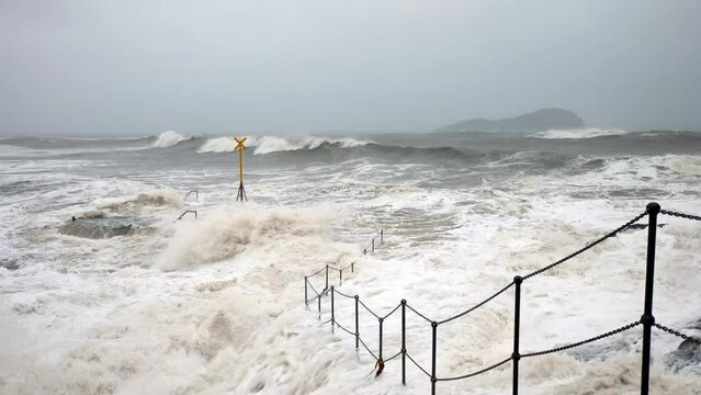 Stormy waves crashing into the coastline of East Lothian, Scotland