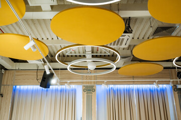 Beautiful banquet hall interior, ceiling lighting, round llama on the ceiling, LED lamp.