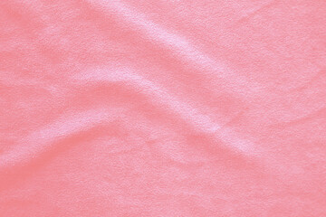 Blurred of Light Pink gold silk satin. Soft folds. Fabric. Pink luxury background. Space for...
