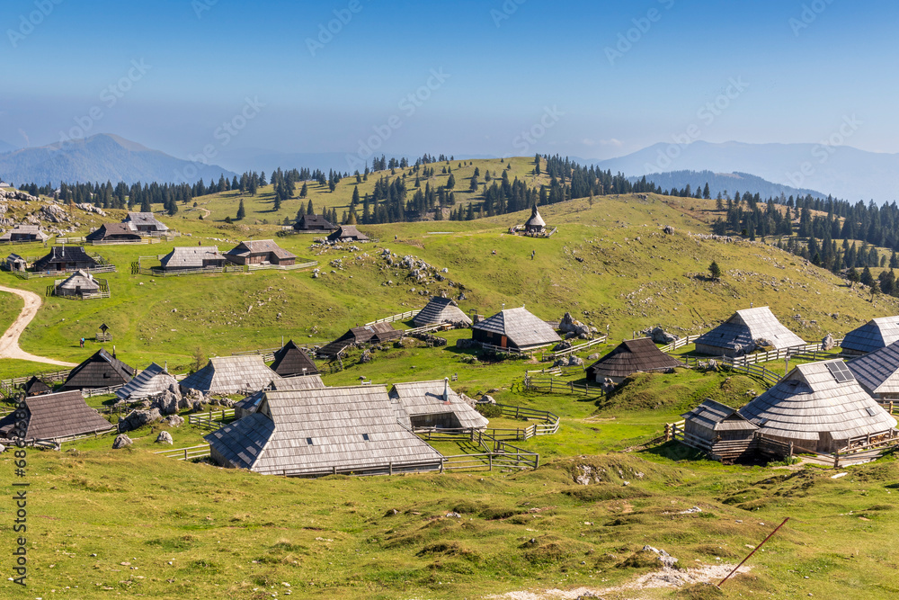 Wall mural Velika Planina. 10-02-2023. Velika Planina village. Old  shepered village with wooden houses in Kamik Alps.