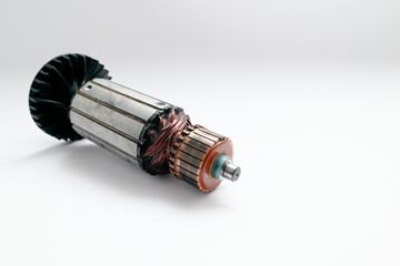 Old rotor of electric motor on white background. Copper coils inside electric motor
