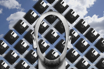 Digital collage in surrealism style with head of a man and floppy disk on background