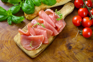smoked ham of pork on a wooden board