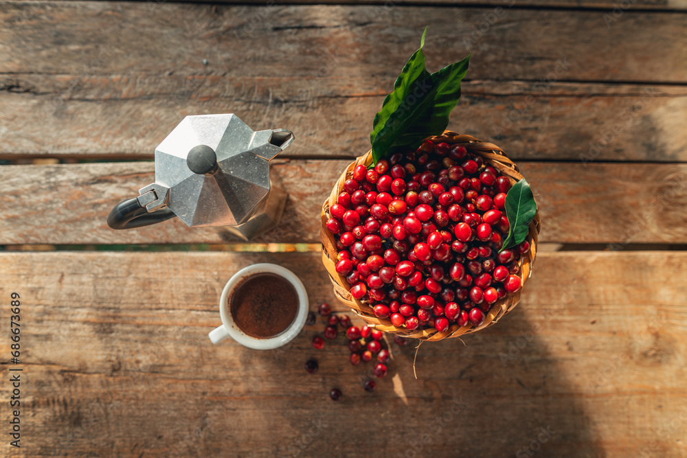 Sticker coffee cherry beans in a basket placed on a wooden table