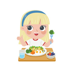 Kid having delicious food. Happy girl enjoy eating fresh salad and fruits.