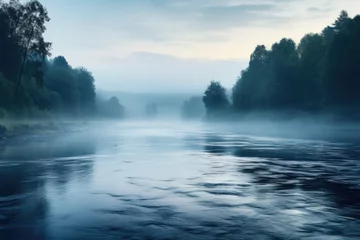 Foto op Plexiglas A serene image of a foggy river with trees in the background. Perfect for nature and landscape themes. © Ева Поликарпова