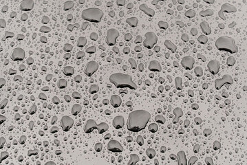 Rain drops on a metal surface