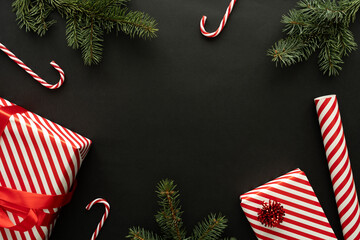Red and white stripes wrapping paper roll, striped pattern Christmas gift boxes and candy canes...