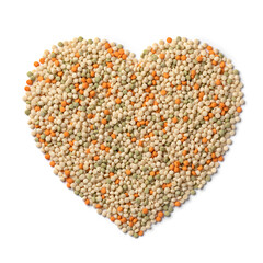 Raw uncooked pearl couscous tricolore in heart shape isolated on white background close up