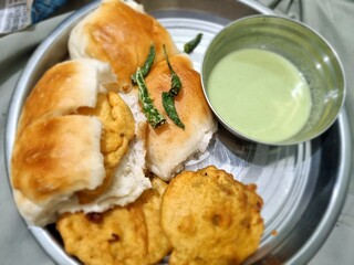 Delicious Vadapav breakfast meal on a plate, close-up and appetizing.