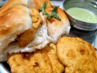 Delicious Vadapav breakfast meal on a plate, close-up and appetizing.