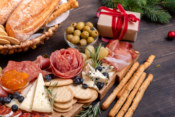 Party charcuterie board italian food antipasti prosciutto ham, salami and cheese appetizers served...