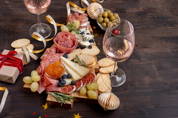two glasses of champagne, Prosecco or rosé wine , festive aperitif or party with cold meat...