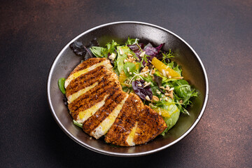 Delicious salad with chicken, orange and arugula